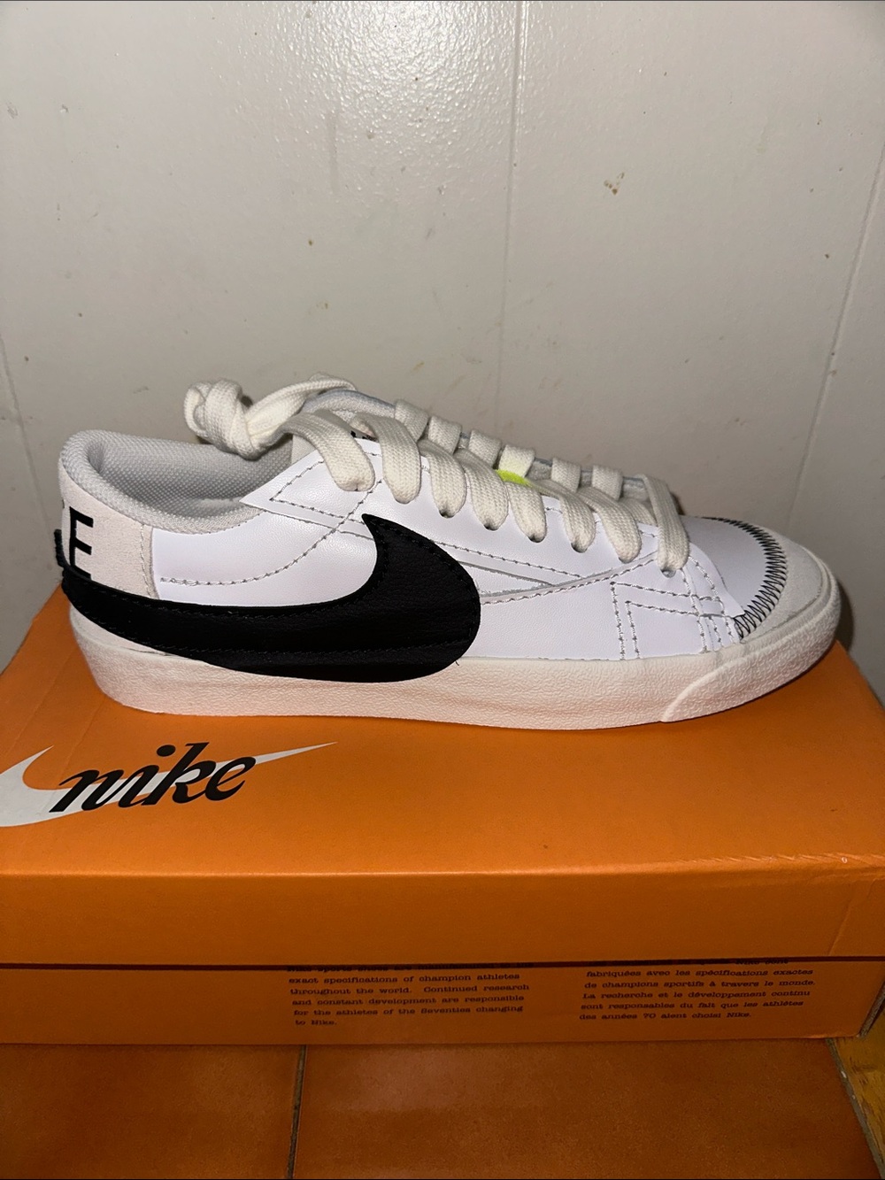 Nike White Sneakers with Black Swoosh Low-Top